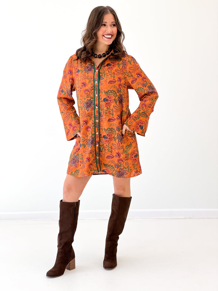 Orange floral bell-sleeve button dress, dark trim and long cuffs, front view