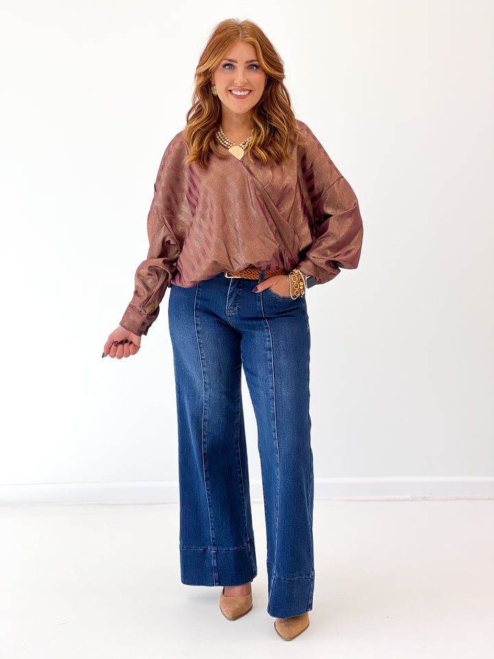 Burgundy metallic stripe wrap blouse with V-neck, long billowy sleeves, side sash