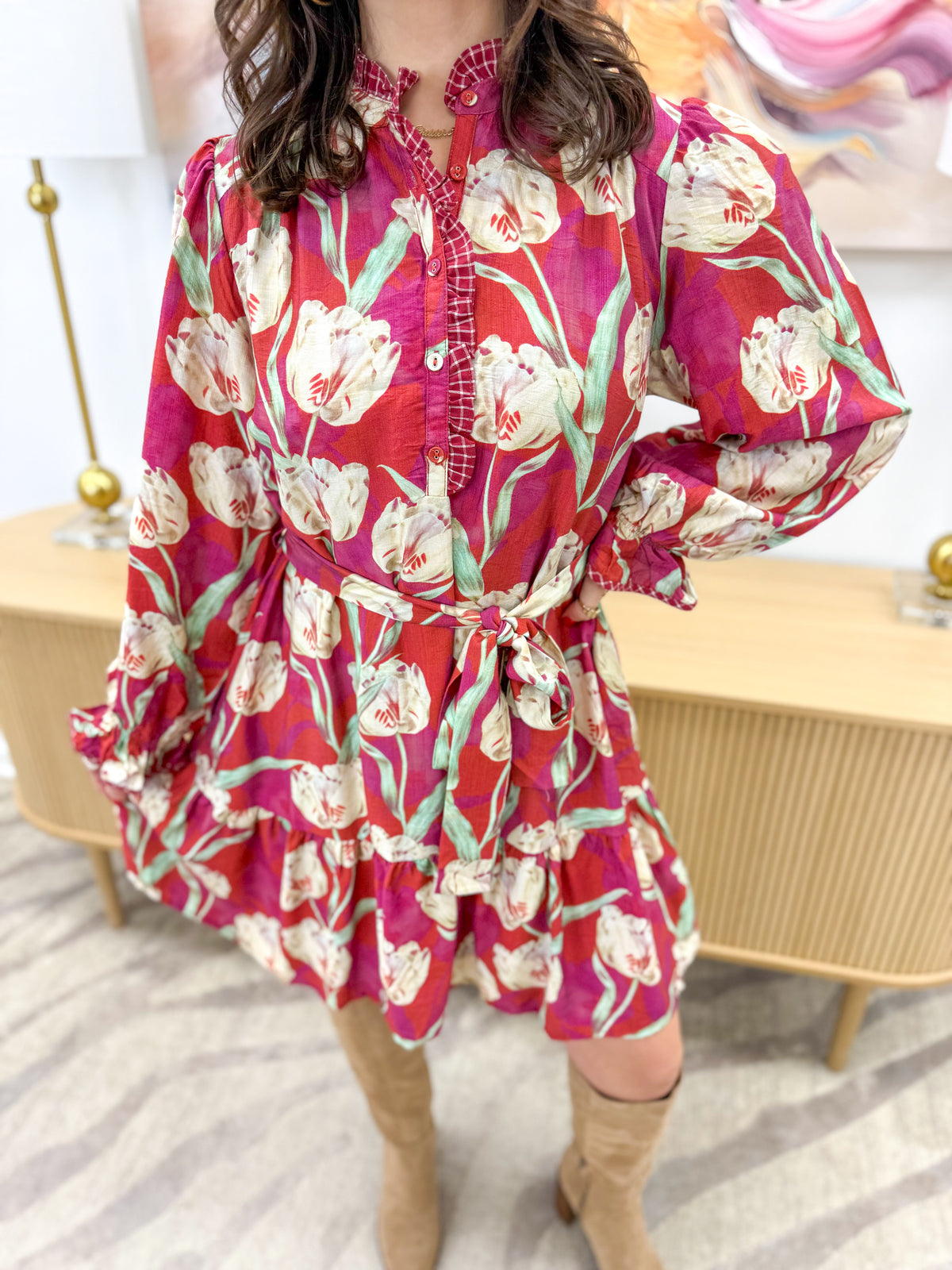 Crimson floral belted tiered mini dress close-up with long sleeves and ruffled tiers