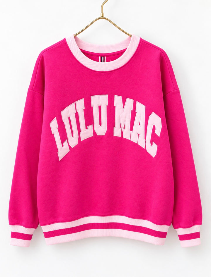 Hot pink crew neck sweatshirt with light pink striped cuffs and hem, “LULU MAC” logo