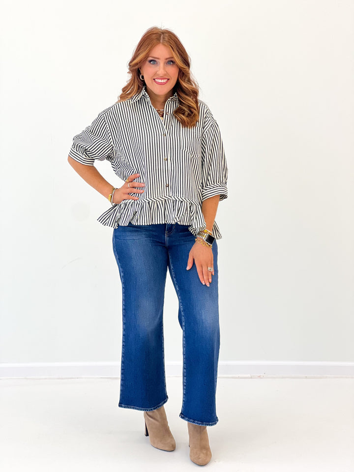 Striped peplum blouse with curved hem ruffle, button placket, and cuffed sleeves