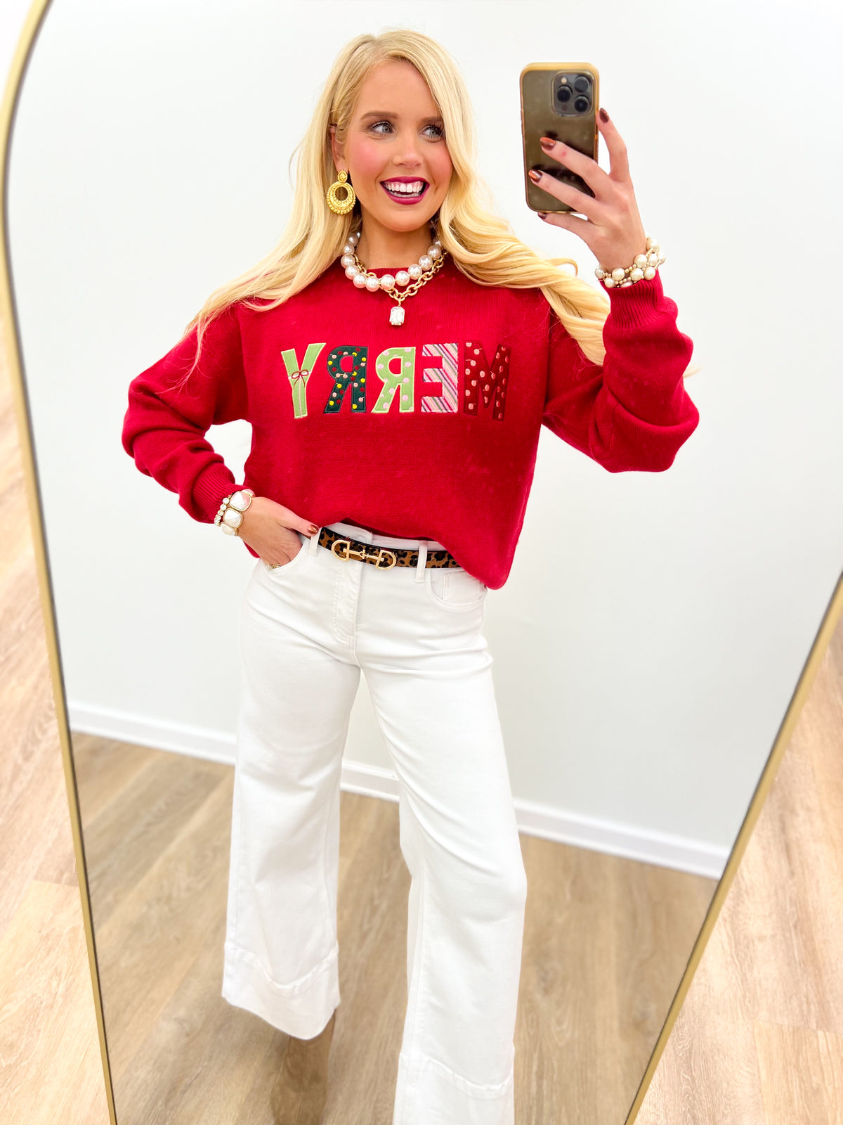 Red knit Christmas sweater with “MERRY” graphic and long sleeves
