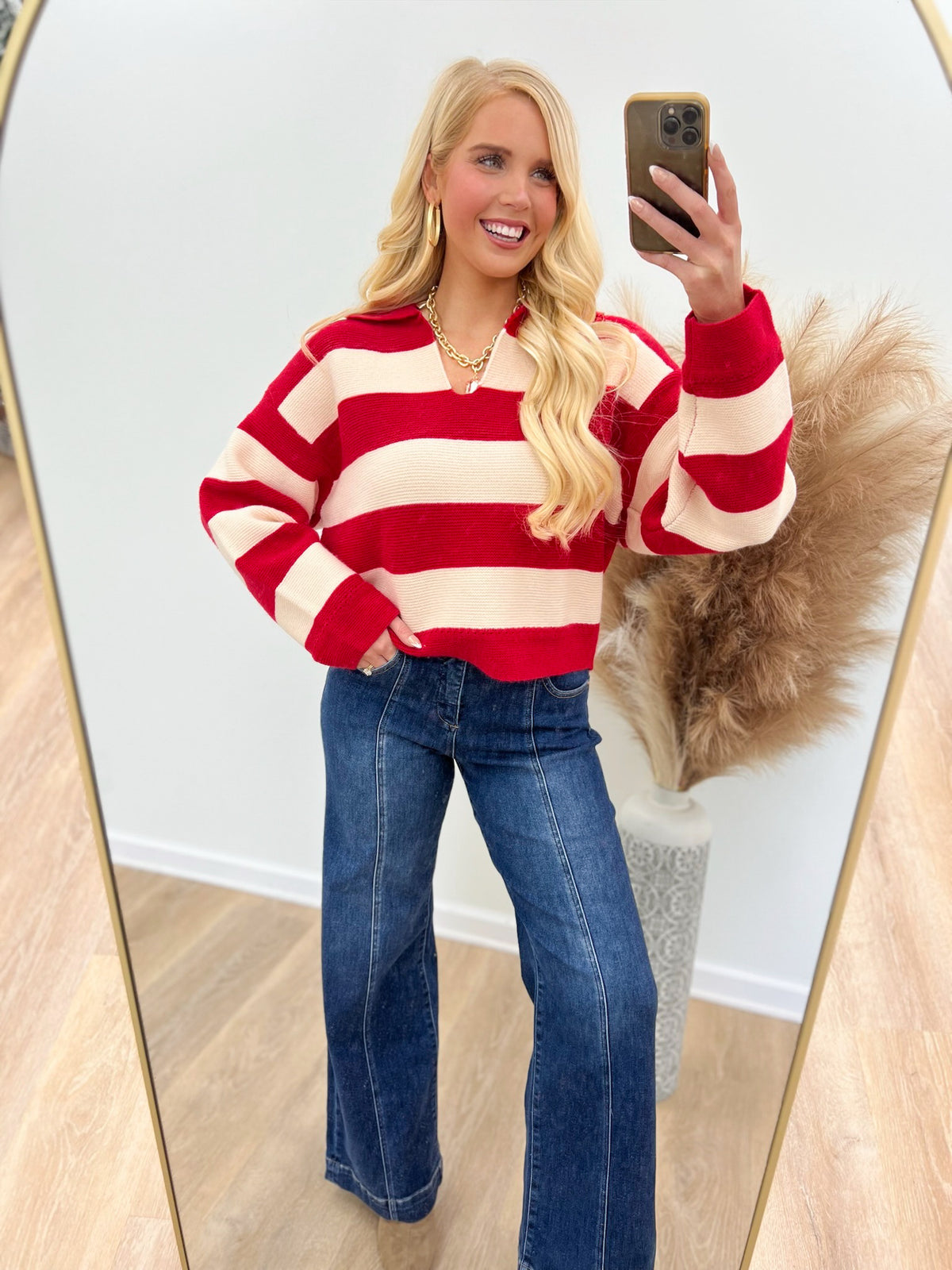 Red and ivory striped V-neck sweater with long sleeves