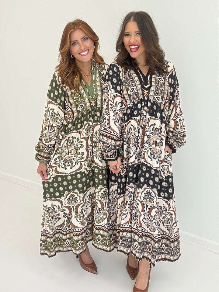 Abstract print midi dress with contrast trim, long sleeves, V-neck, and pockets