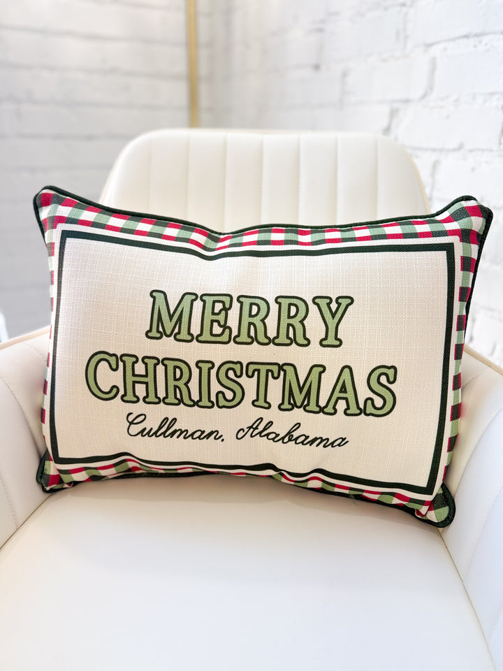 Cream Christmas pillow with red-green plaid trim; green 'MERRY CHRISTMAS' and 'Cullman, Alabama'