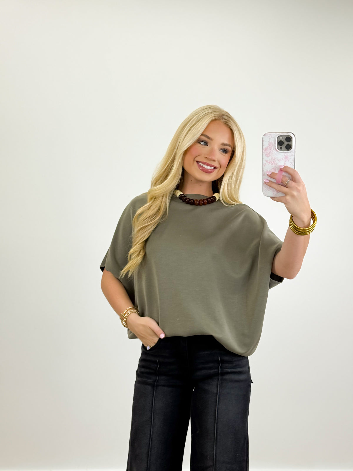 Washed black mid-rise cropped jeans with wide leg and front pockets