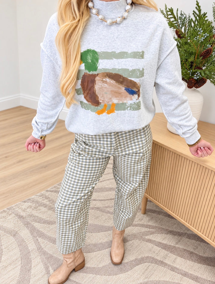 Light gray mock neck sweatshirt with multicolor duck graphic