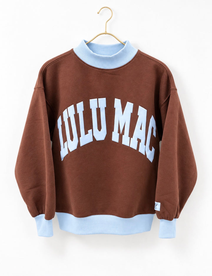 Brown puff mock neck sweatshirt with light blue rib trim and white 'LuLu Mac' print