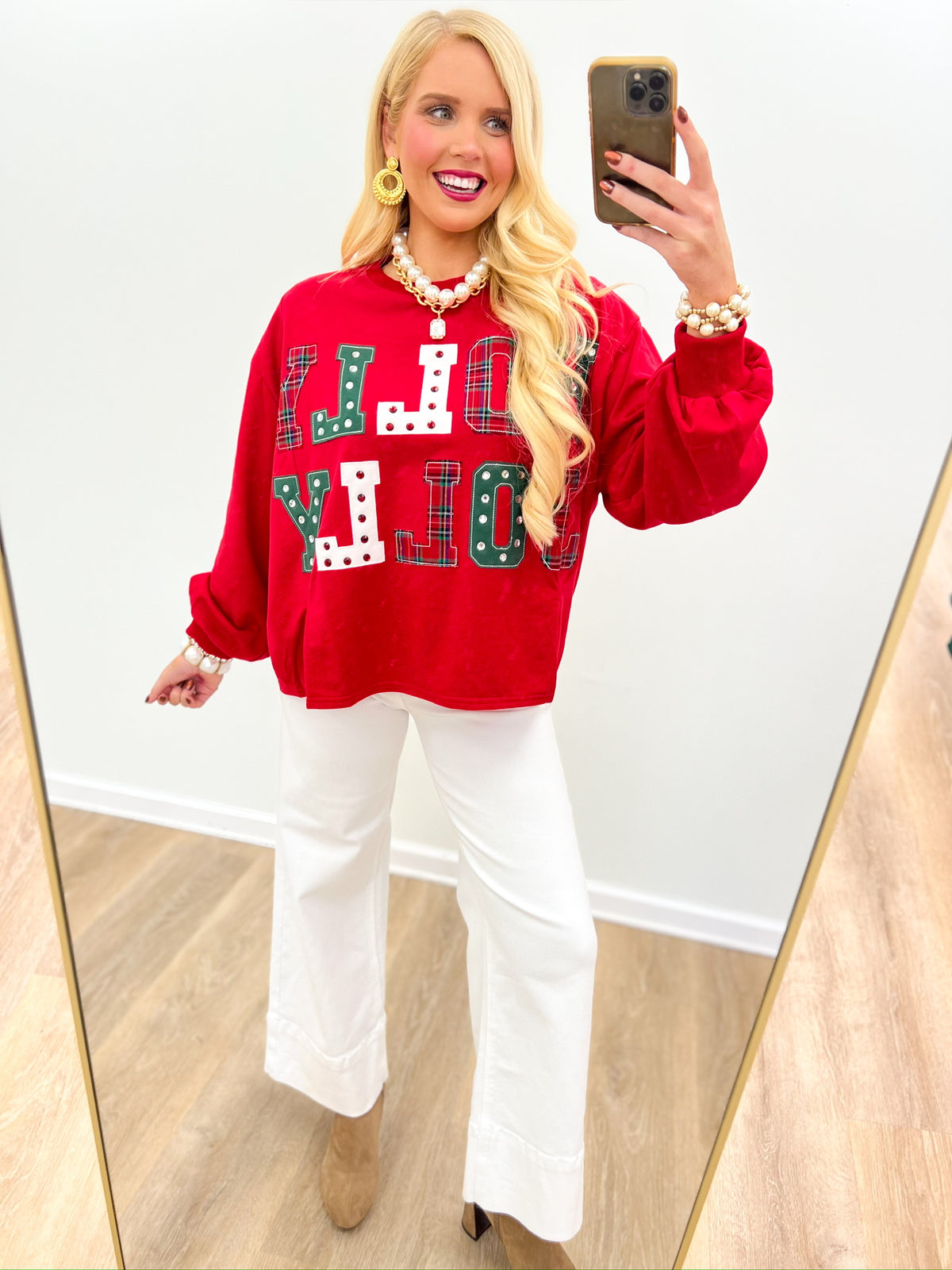 Red crewneck Christmas sweatshirt with colorful patchwork holiday letter graphic