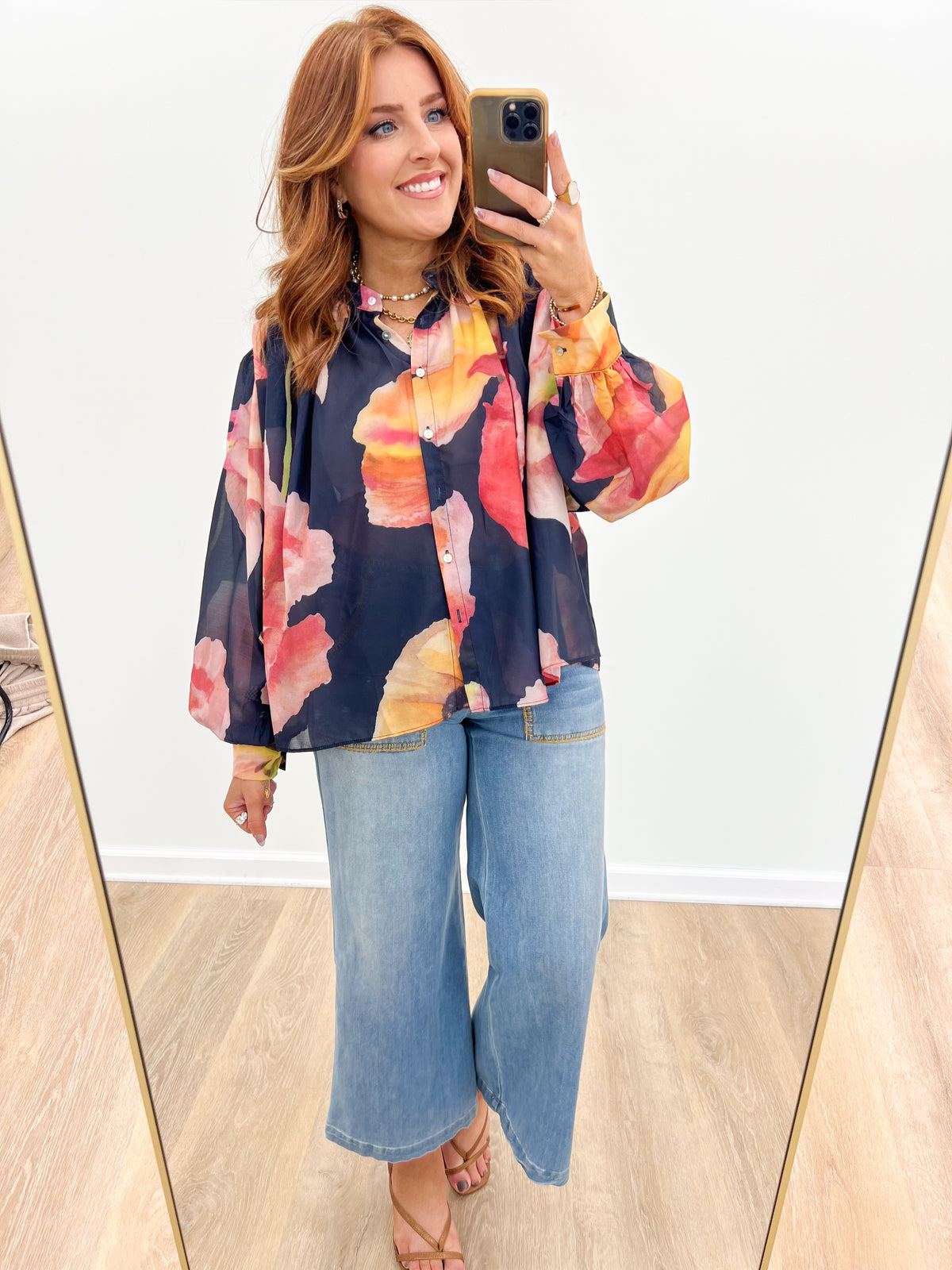 Multicolor floral print blouse in navy with button front and voluminous sleeves