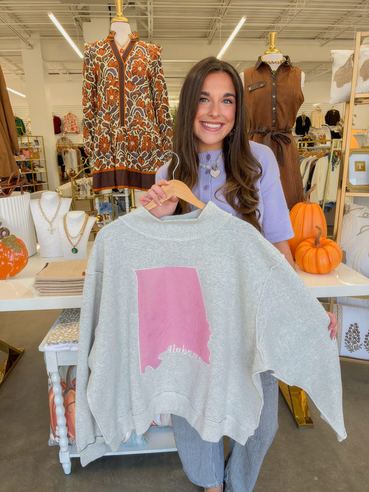 Ash gray oversized mock neck pullover with pink Alabama state graphic, worn