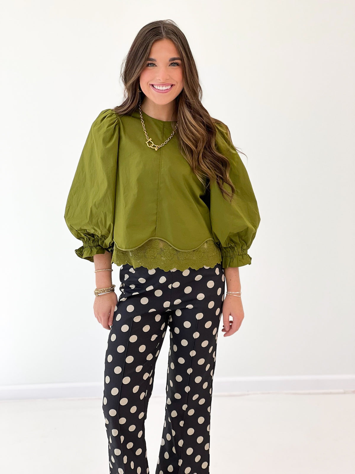 Olive green lace-trim balloon sleeve top with scalloped hem and scoop neckline
