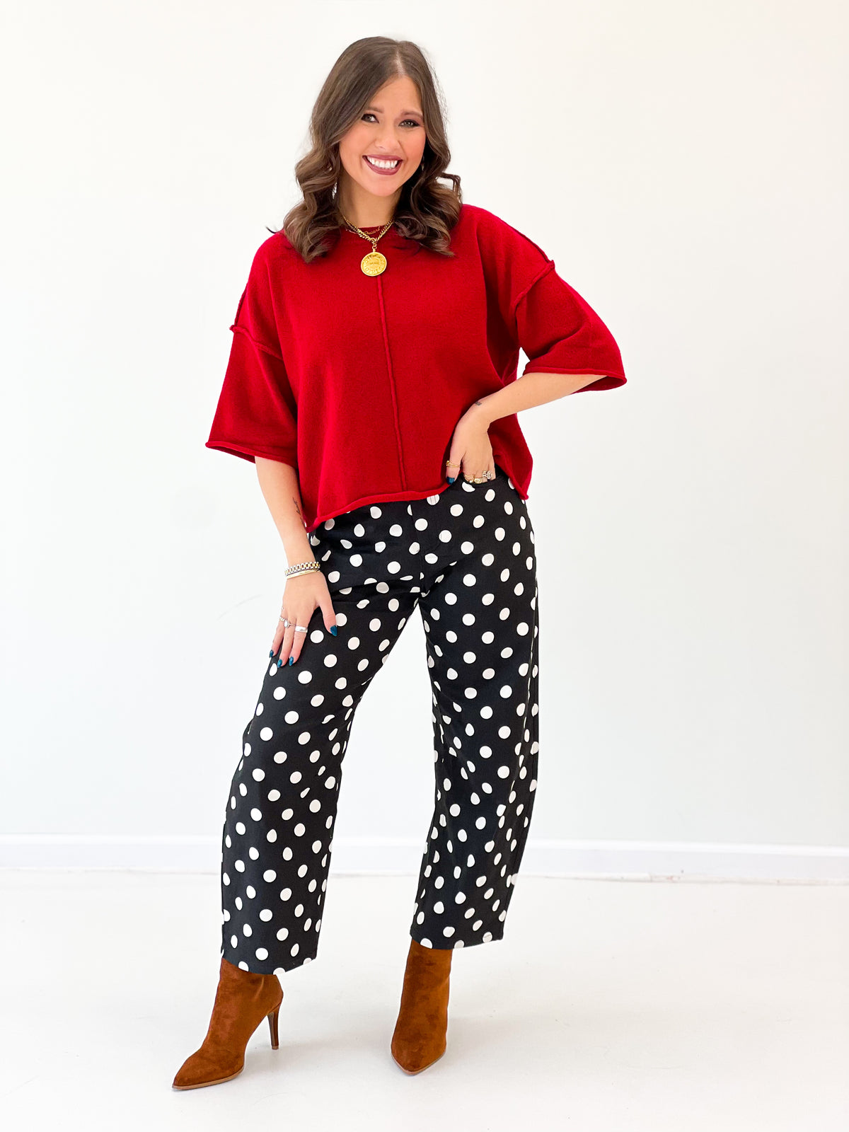 Red crewneck short-sleeve sweater with loose fit and wide neckline seam detail.