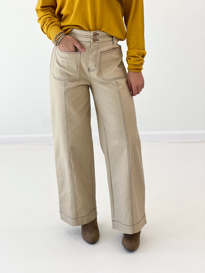 Entro bone pants, light tan with front patch pockets and relaxed straight-leg fit