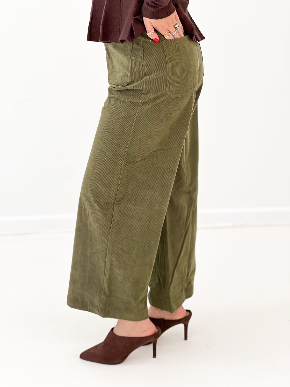 Olive corduroy wide-leg pants with front pockets, relaxed high waist