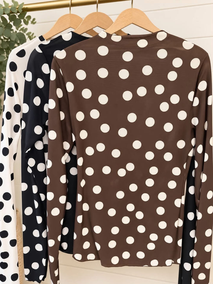 Brown polka dot mesh long-sleeve top with white circular pattern