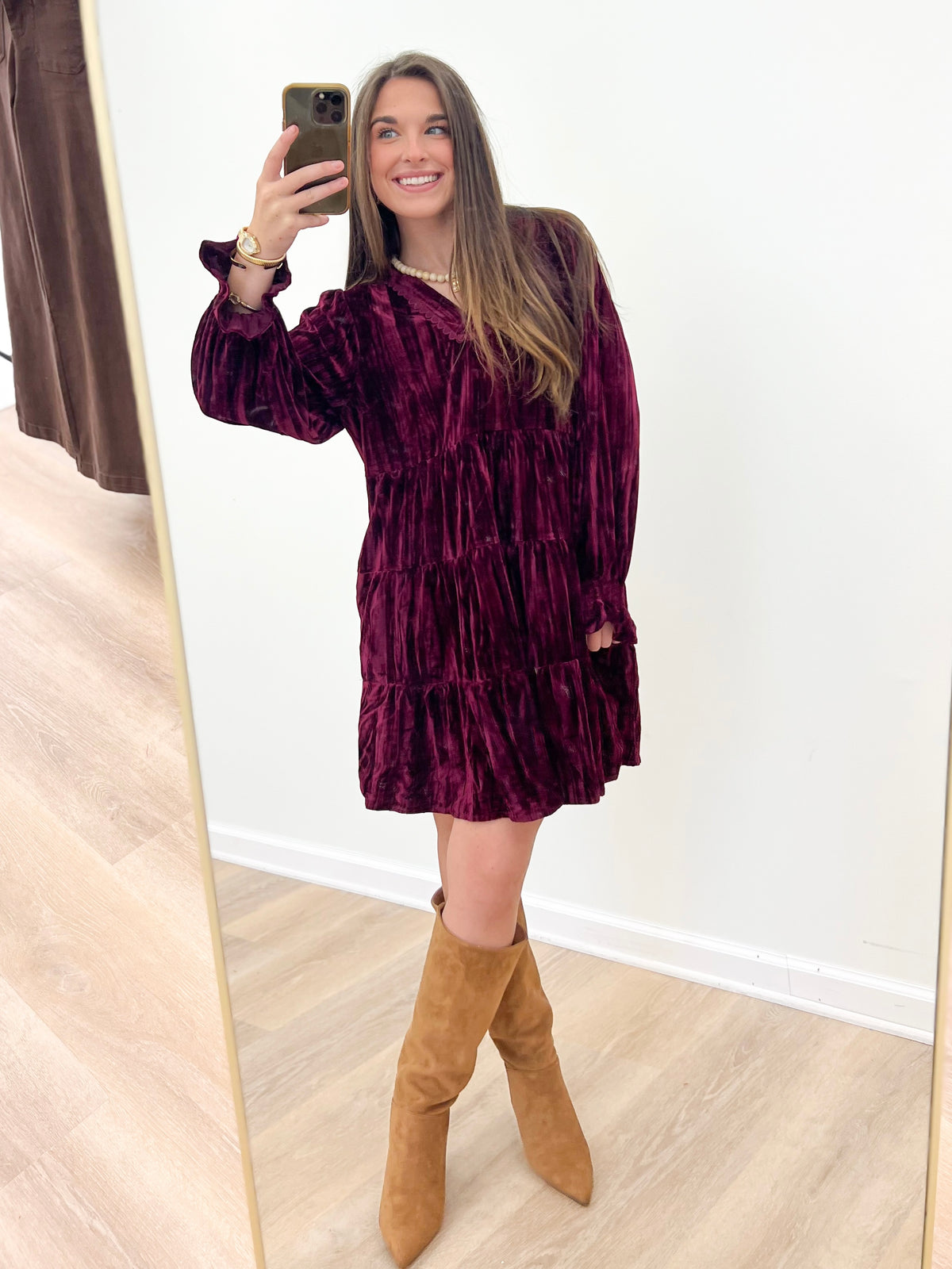Burgundy velvet tiered mini dress with V-neck and long ruffled sleeves