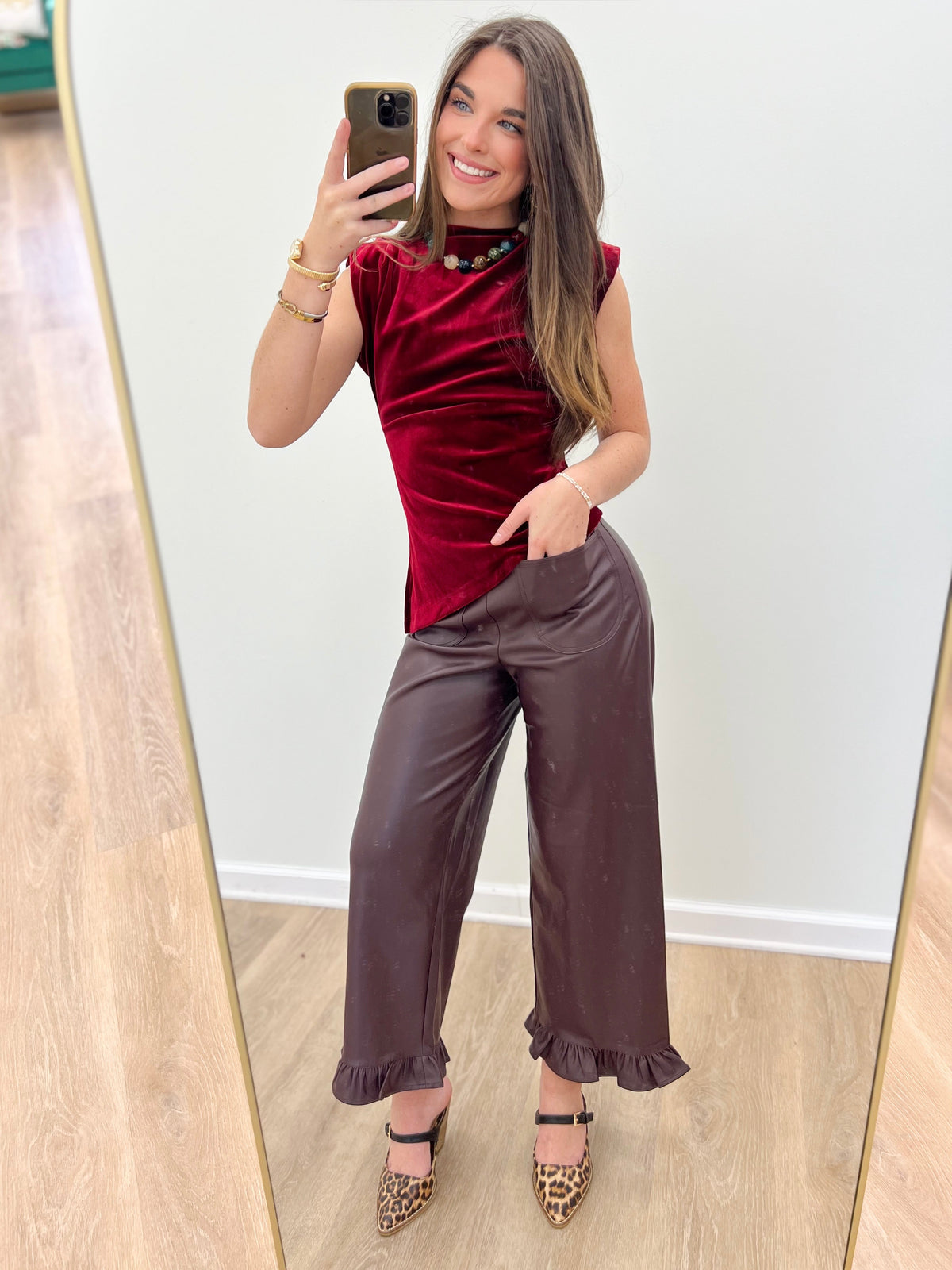 Deep fig pleather pants with ruffle cuffs, straight leg and side pockets