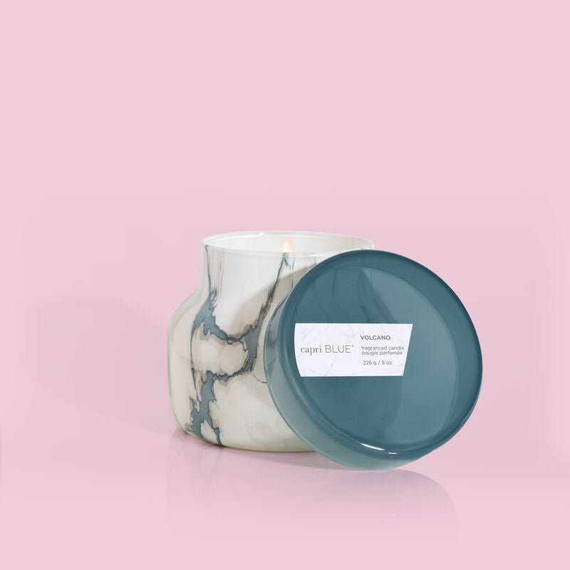 Volcano scented petite candle in a marble-look jar