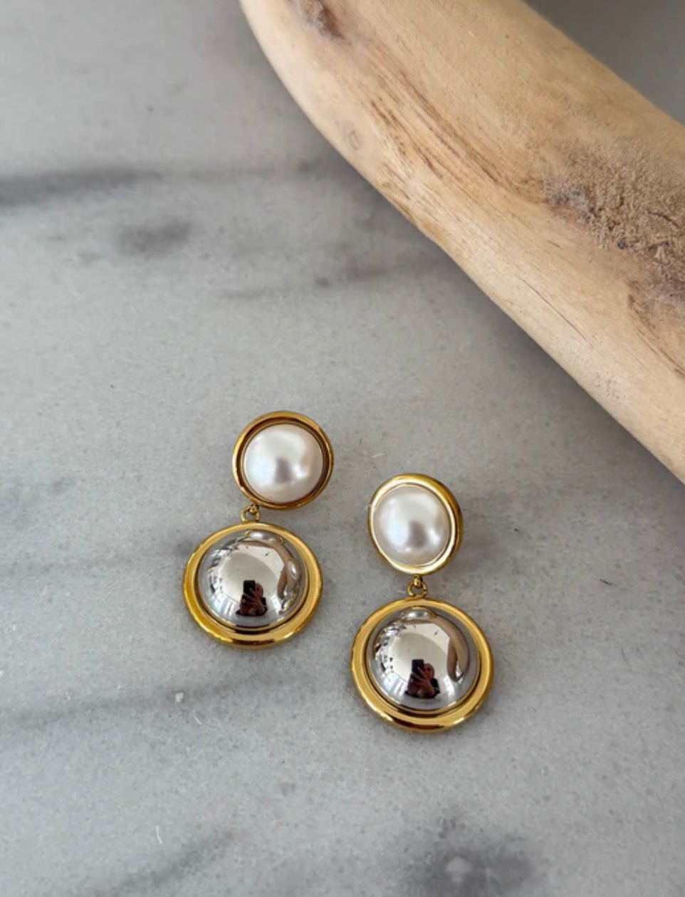 Pearl drop earrings with a gold finding