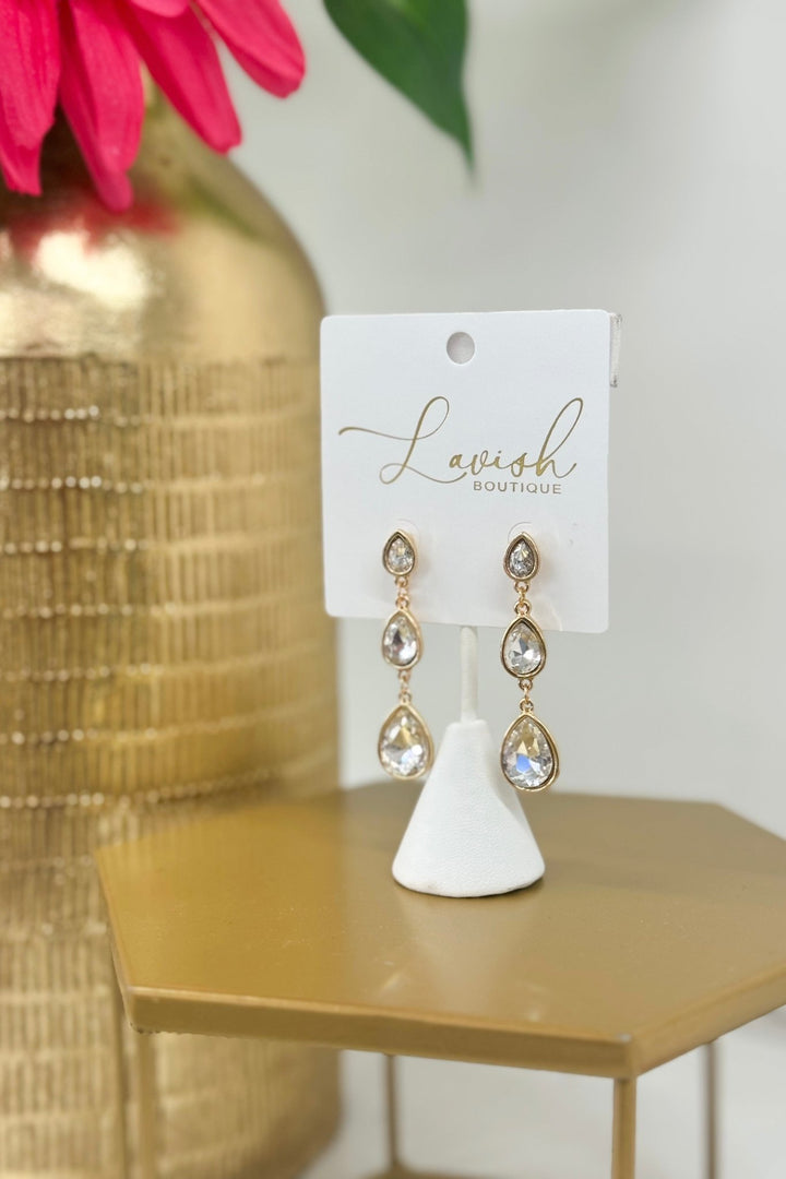 Clear and gold linear earrings with graduated teardrops