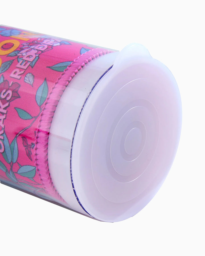 Clear tube end cap on pink patterned tube, rounded white cap with circular center