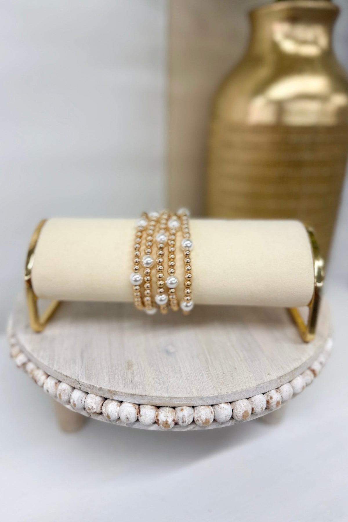 Five-row cream pearl station bead bracelet in gold