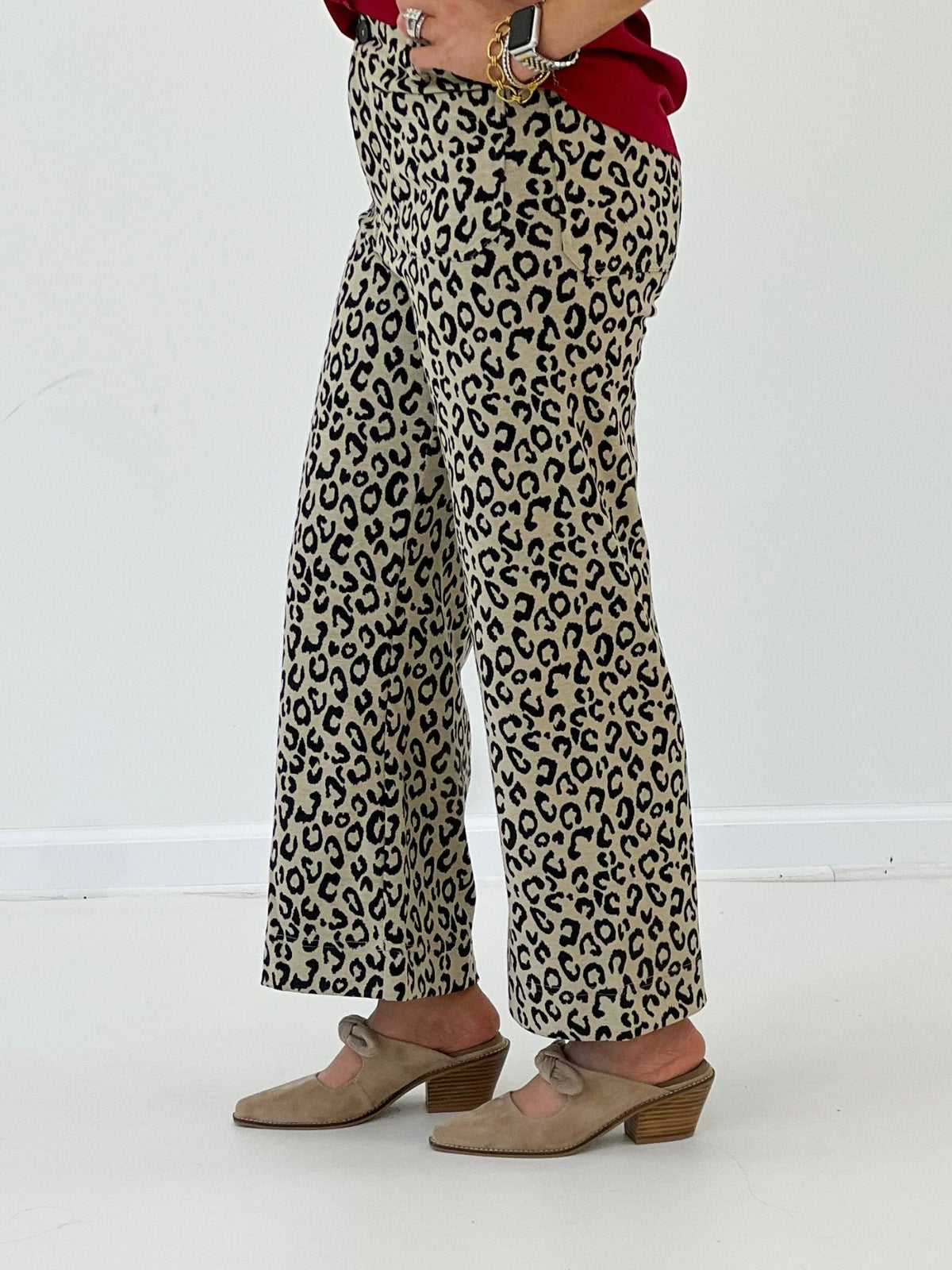 Taupe leopard print pants with a front zip and slim leg