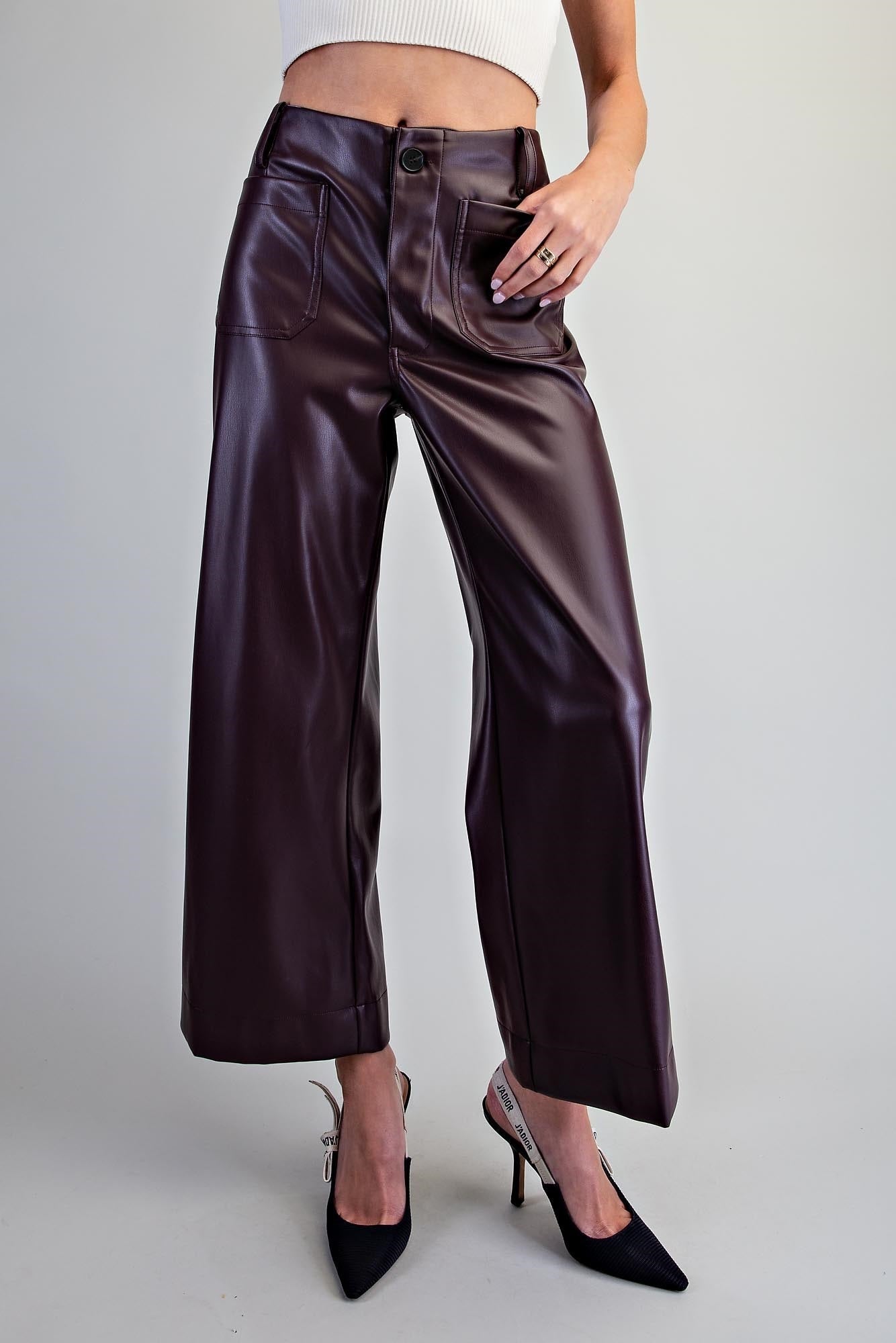 Black pleather pants with patch pockets and a relaxed leg
