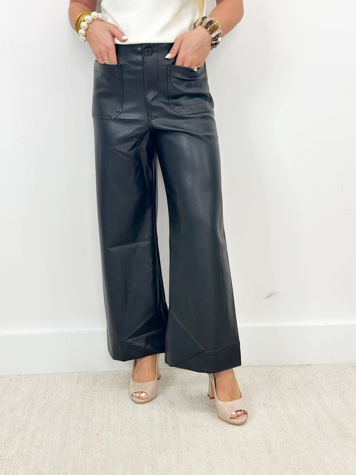 Black faux leather pants with large patch pockets