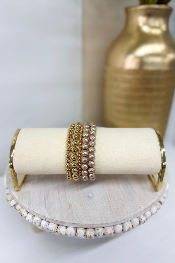 Five-row bracelet of light brown pearls with gold accents