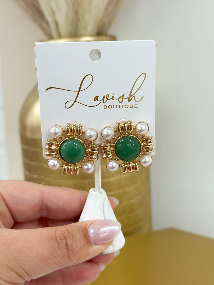 Earrings pairing a faceted stone with a pearl drop