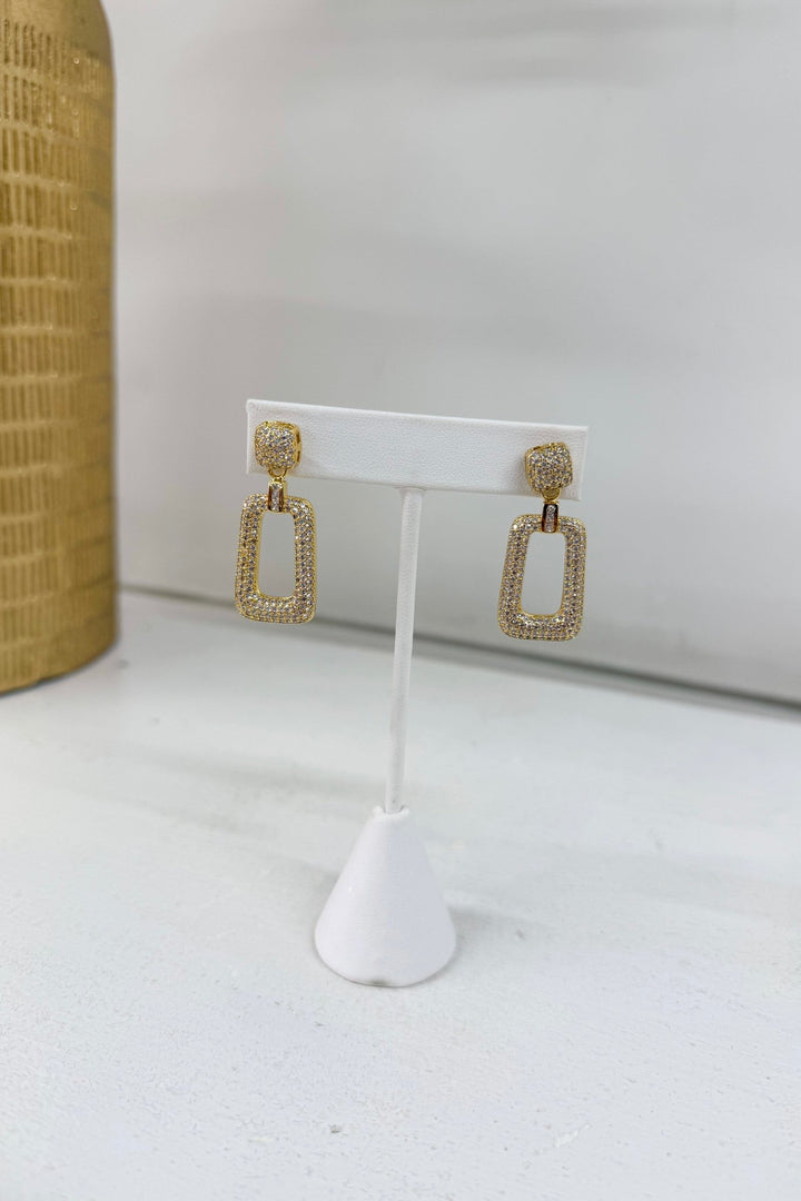 Gold drop earrings with a polished finish