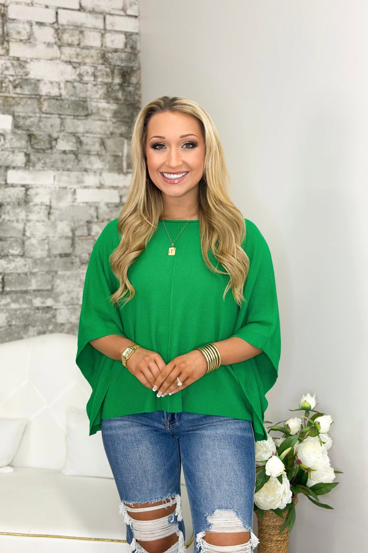 Green knit top with batwing sleeves