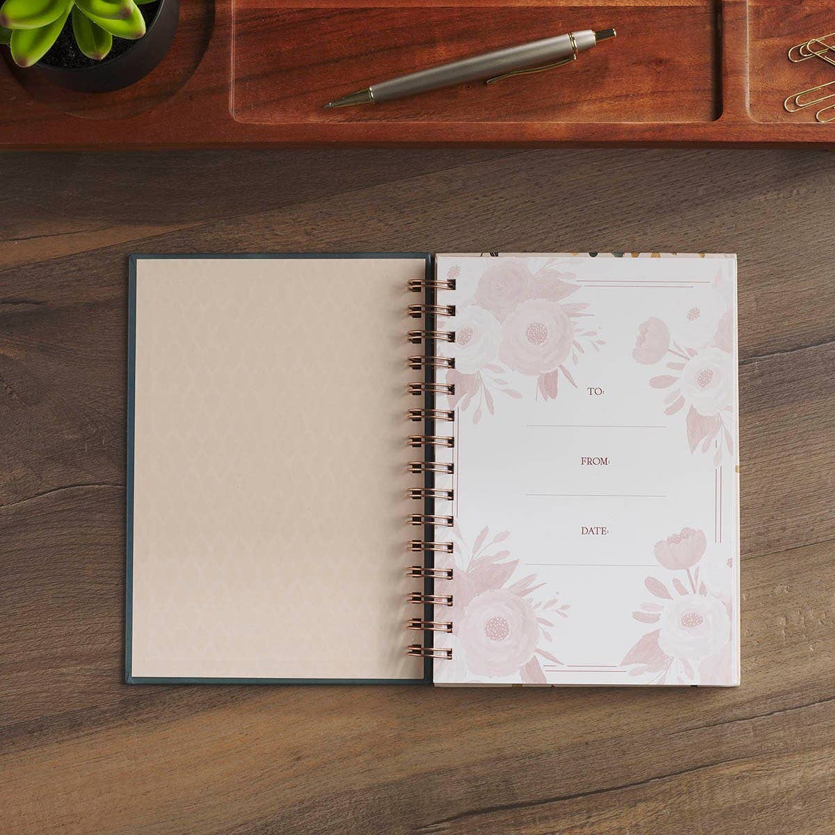 Colorful spiral-bound scripture journal quoting Romans 12:12