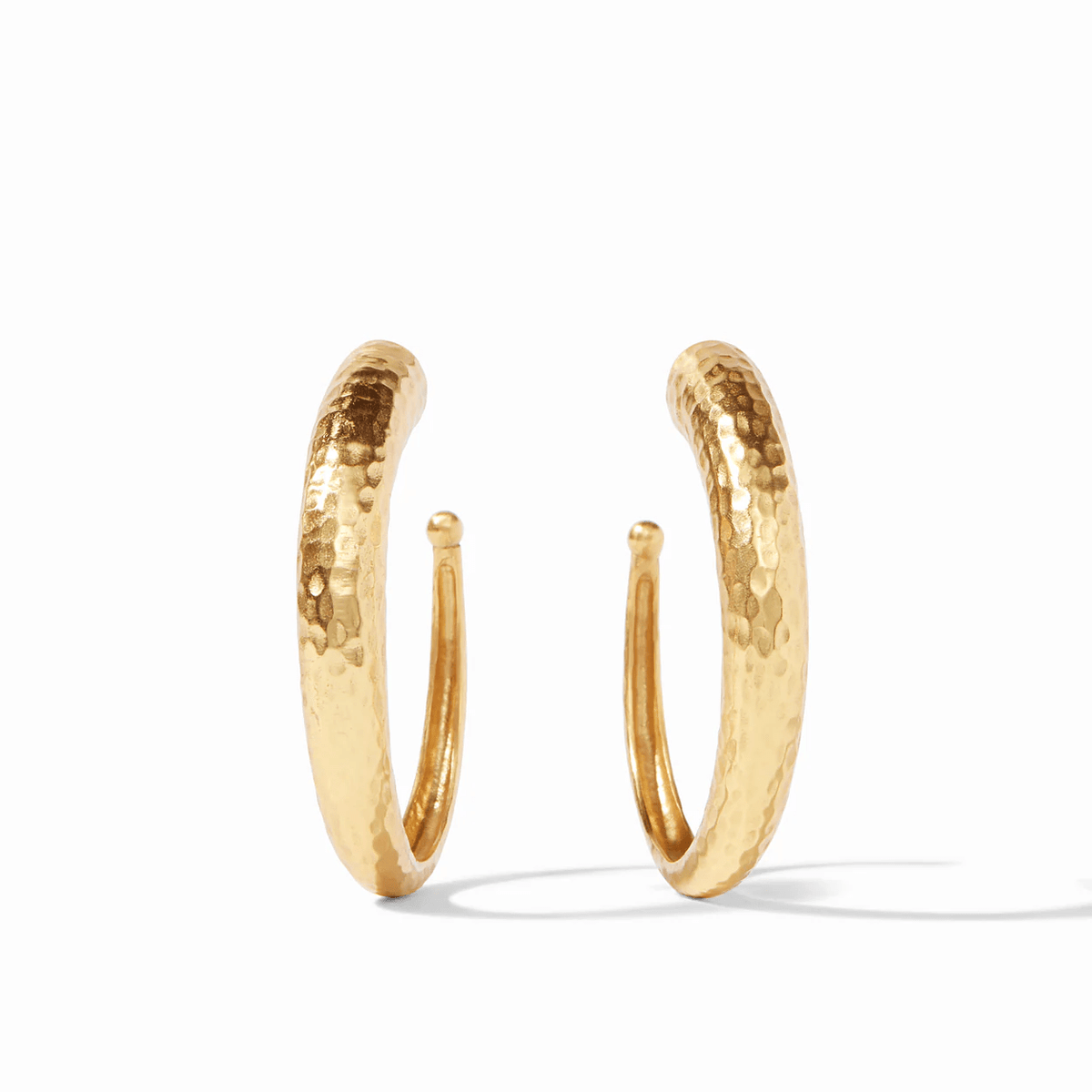 Large gold hoops with a hammered finish