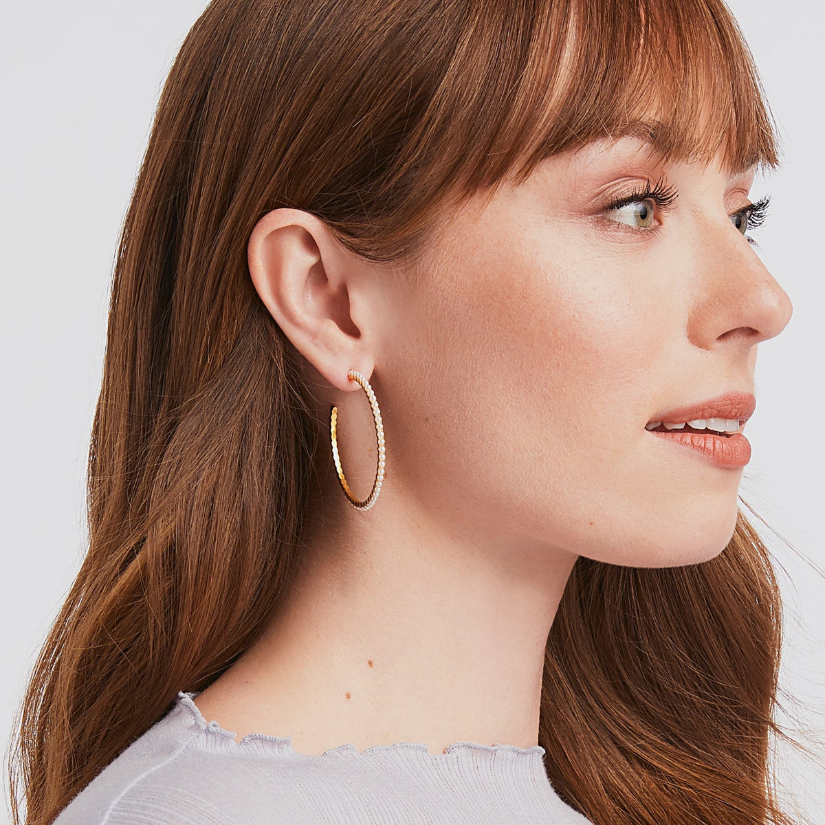 Juliet pearl hoops in a classic round silhouette