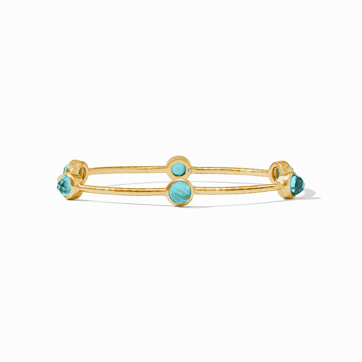 Gold luxe bangle set with a single colored stone