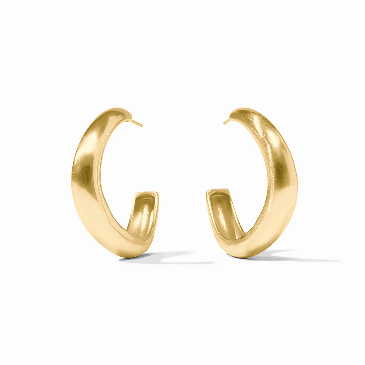 Gold hoop earrings with a wave-shaped band