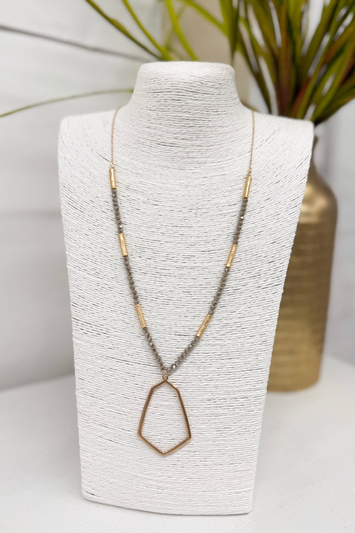 Light mocha beaded necklace with a hexagon pendant