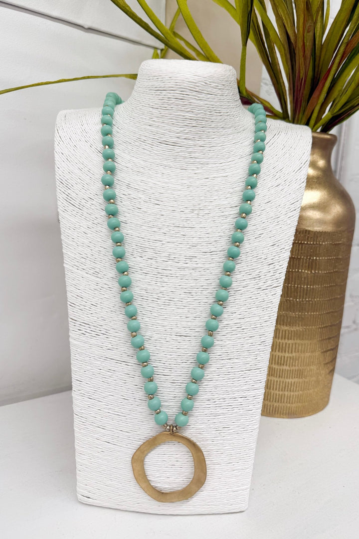 Mint beaded necklace with a circle pendant