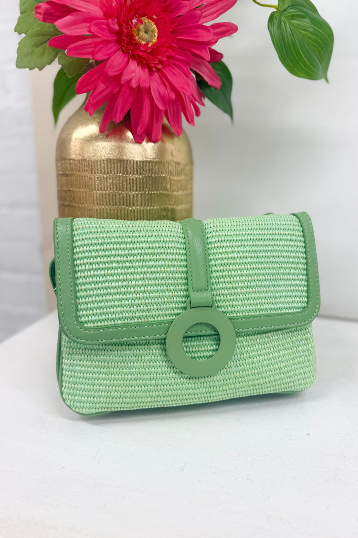 Mint straw crossbody bag with a woven body