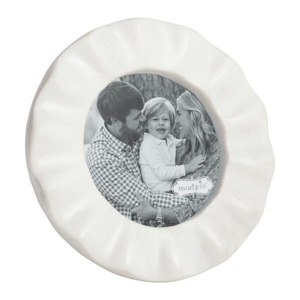 Round marble picture frame with a ruffled edge