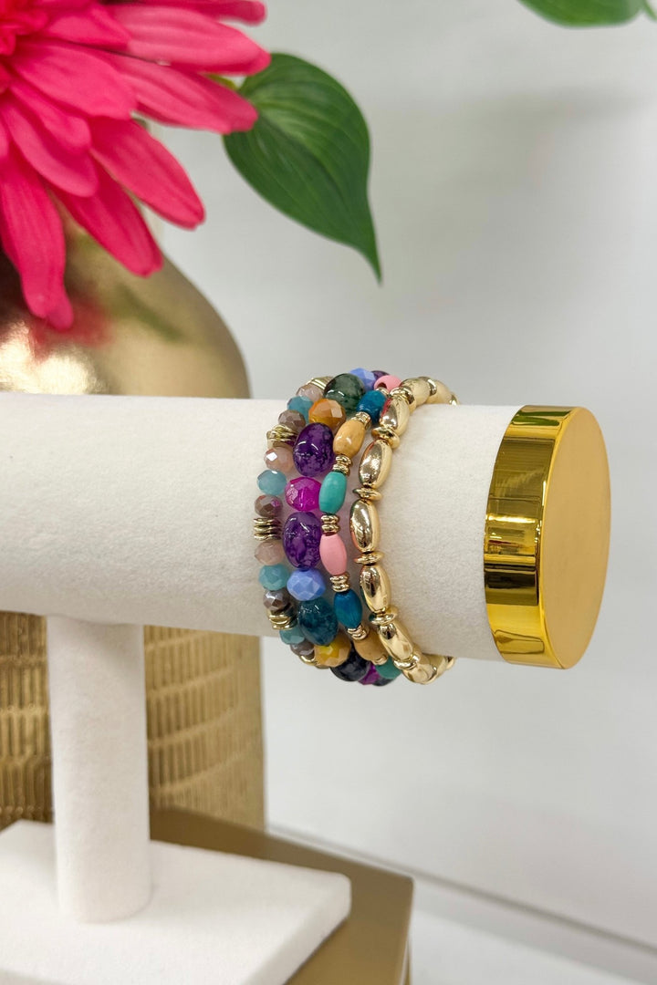 Four-row bracelet of multicolor glass and wood beads