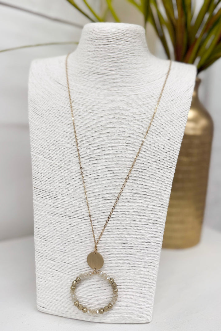 Natural bead necklace with circle and disc pendants