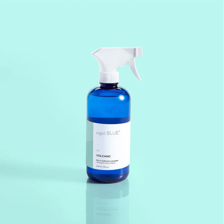 Blue multi-surface cleaner bottle with white label and trigger sprayer