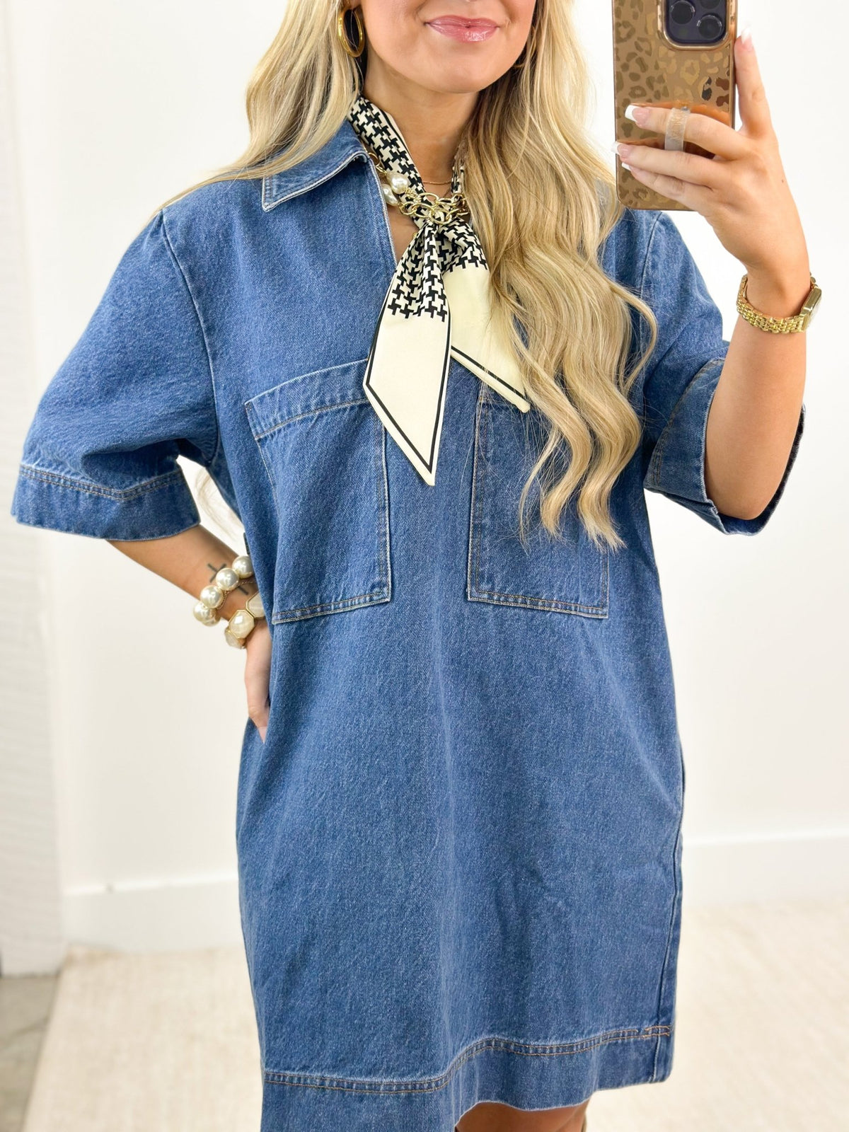 V-neck denim dress in a mid-wash blue