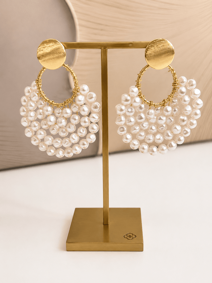 Cream pearl crescent drop earrings in gold