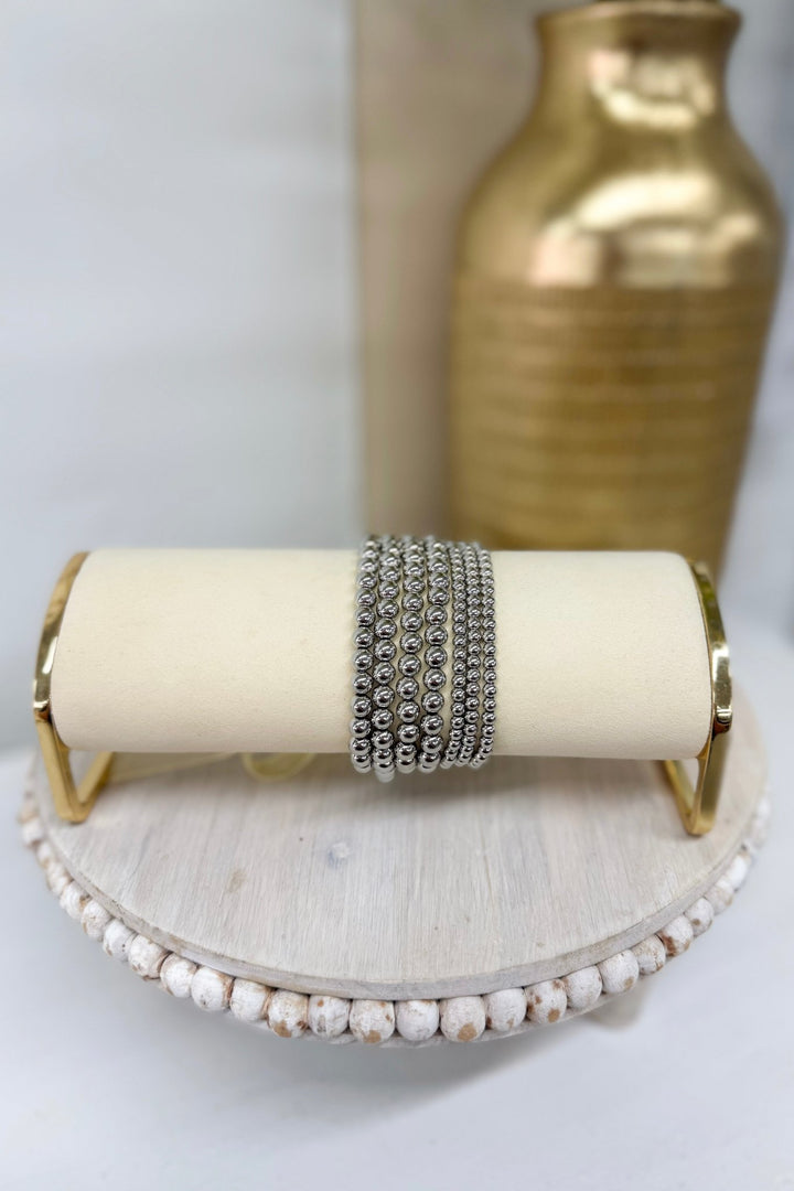 Rhodium metal ball bracelet with a ribbon tie