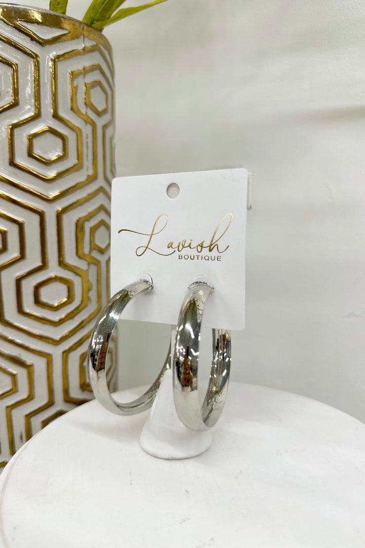 Rhodium hoops with an oval cross-section band